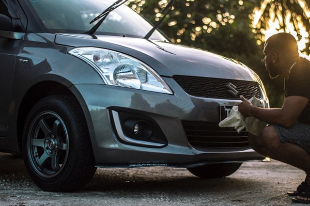 man washing a car